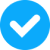 White tick in blue circle icon